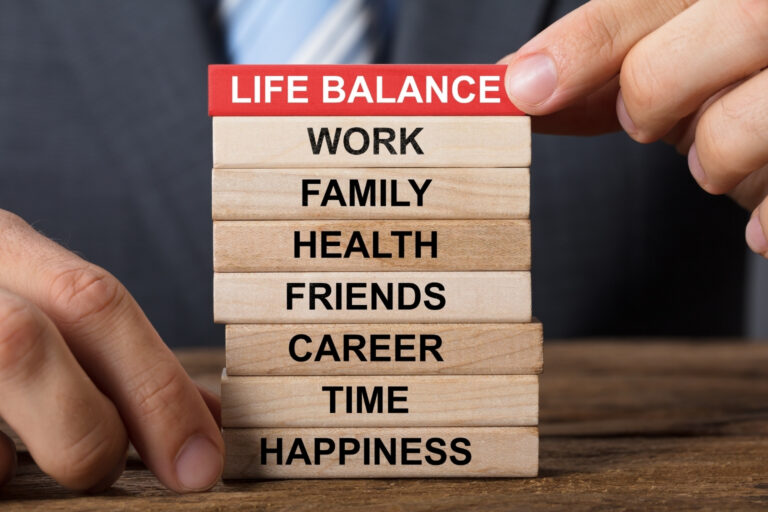 life balnce areas listed on wooden blocks