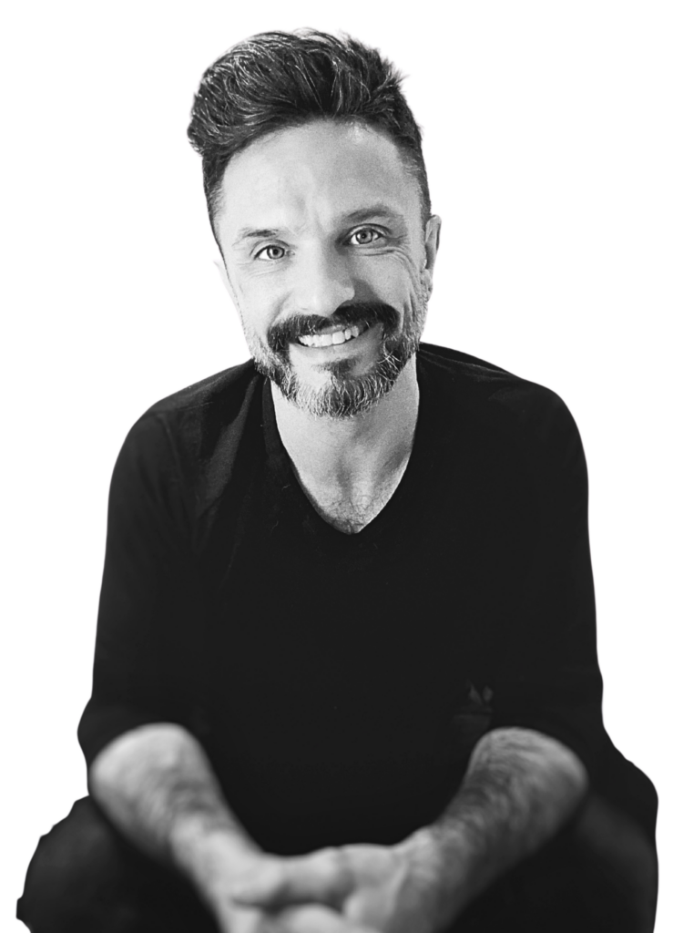 marc scheff, coach and artist, smiling with hands folded